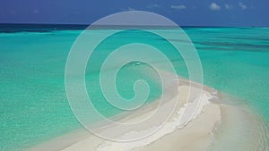 Luxury fly over island view of a white sandy paradise beach and turquoise sea background in colorful 4K