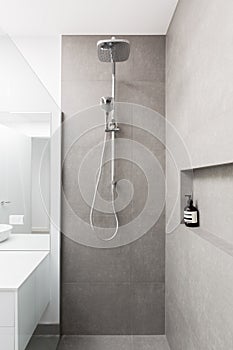 Luxury fully tiled shower with rain head and hand held shower