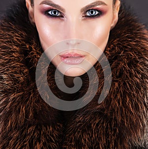 Luxury fur and beautiful girl with strong makeup