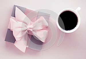 Luxury gift box and coffee cup on blush pink background, flatlay design for romantic holiday and birthday surprise