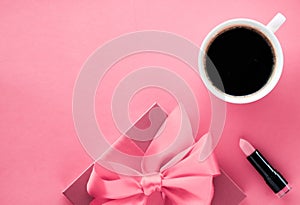 Luxury gift box and coffee cup on pink background, flatlay design for romantic holiday morning surprise