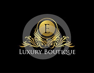 Luxury Gold Boutique Logo Vector Design. Premium Golden Bagde E Letter Icon photo