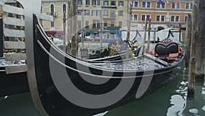 Luxury gondola boats attracting tourists for romantic sightseeing tour in Venice