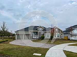 A luxury gray house in the Laureate Park neighborhood in Lake Nona