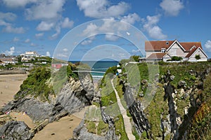 Luxury home on cliffs, tidal sea beach, blue sky