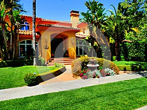 A luxury home entrance with decorative fountain in front