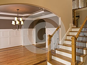 Luxury Home Entranceway with Descending Staircase