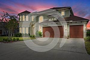 Luxury Home Exterior Dusk Dawn Night Lawn Sunset Interior Lights Turned on Horizontal Orientation Landscape Architectural