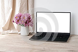Luxury home interior decor and workspace, laptop computer blank display mock up, vase with pink daisy flowers on beige