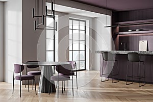 Luxury home kitchen interior with bar island and dining table, window