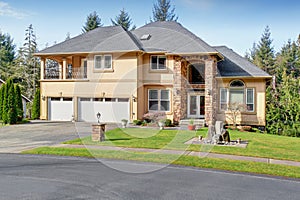 Luxury home with large grassy front yard.