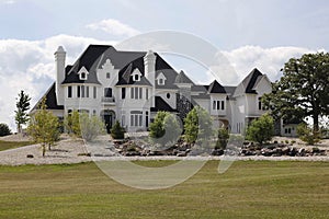 Luxury home with stone landscaping