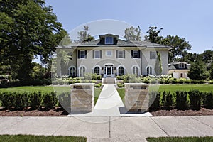 Luxury home with stone pillars