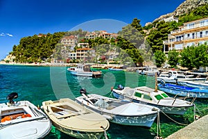 Luxury homes and fishing boats in harbor,Brela,Dalmatia,Croatia
