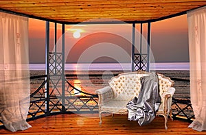 Luxury hotel balcony room with sunset ocean window view