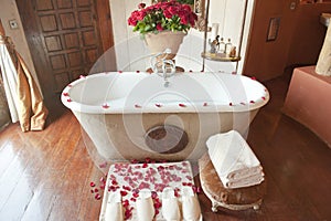 Luxury bathroom with red roses and petals, Ngorongoro Crater Lodge, Tanzania
