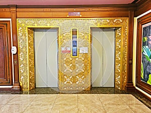 Luxury hotel building gold elevator entrance, Mido hotel photo