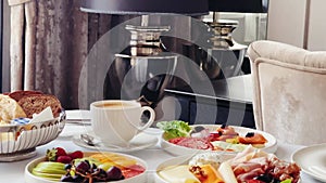 Luxury hotel and five star room service, various food platters, bread and coffee as in-room breakfast for travel and