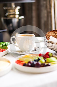 Luxury hotel and five star room service, various food platters, bread and coffee as in-room breakfast for travel and