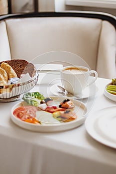 Luxury hotel and five star room service, various food platters, bread and coffee as in-room breakfast for travel and