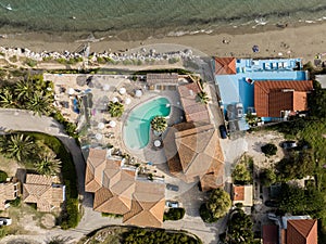 Luxury hotel,swimming pool drone photo.. Aerial view of the beach and swimming pool at luxury resort. Holiday Resort in Zakynthos