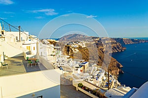 Luxury hotels balconies on Caldera cliff edge Santorini Greece