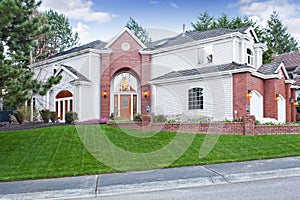 Luxury house exterior with three car garage and driveway