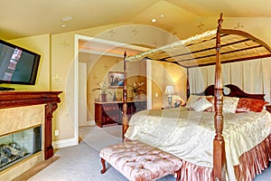 Luxury house interior. Beautiful bed with high posts