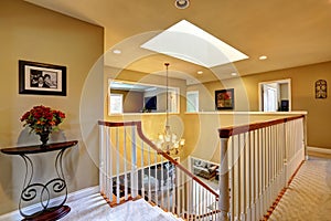 Luxury house interior. Upstairs hallway with staircase