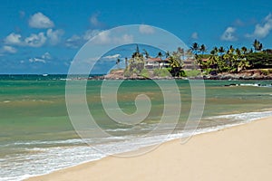 Luxury house on untouched sandy beach with palms trees