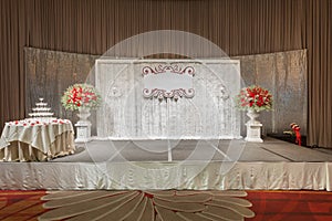 Luxury indoors wedding stage decorate with champagne tower.