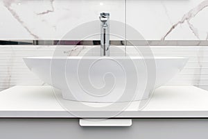Luxury interior of bathroom with sink basin faucet. Modern design of bathroom. Modern hygienic wash basin