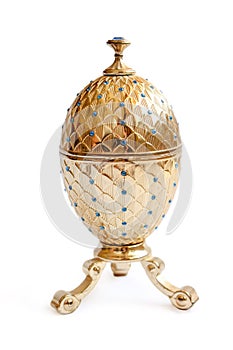 Luxury item - precious jewelry golden egg isolated on white background