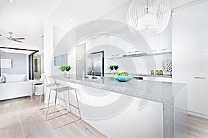 Luxury kitchen chairs and hanging lights with white walls