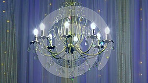 Luxury large crystal chandelier hanging in the Palace.