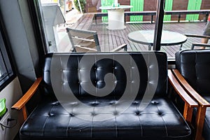 Luxury leather sofa wood arm in vintage cafe