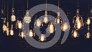 Luxury light bulb hanging decor glowing in dark.