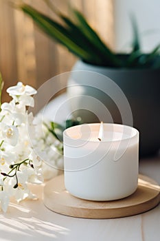 Luxury lighting aromatic scented glass candle display on the grey table in the white bedroom