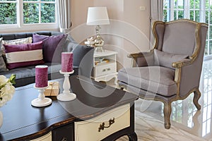 Luxury living room design with classic sofa, armchair and decorative table lamp