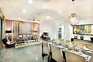 Luxury living room and dining area with hanging lights