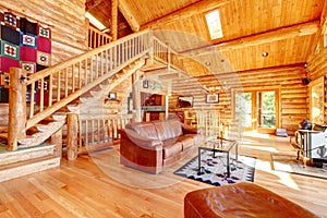 Luxury log cabin living room with leather sofa. photo