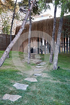 Luxury Lujo hotel territory with well-groomed green grass photo