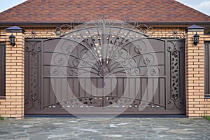 Luxury metal wrought side sliding gates with ornate elements.