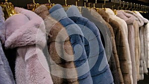 Luxury mink fur winter coat for winter sale on a clothes rack in a retail fashion store. Close up