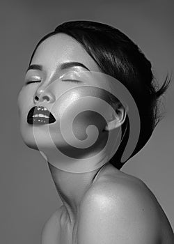 Luxury model with great make-up, gloss lips and perfect hairstyle. Black and white fashion portrait of beautiful woman