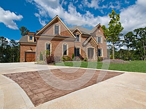 Luxury Model Home Exterior stone driveway