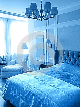 Luxury modern beige and white bedroom interior in classic blue color.