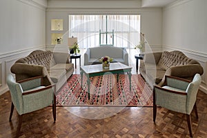 Luxury modern living room with three couches, two armchairs