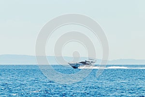 Luxury motor boat cruising in blue sea, Summer vacation