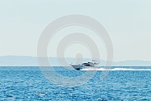 Luxury motor boat cruising in blue sea, Summer vacation